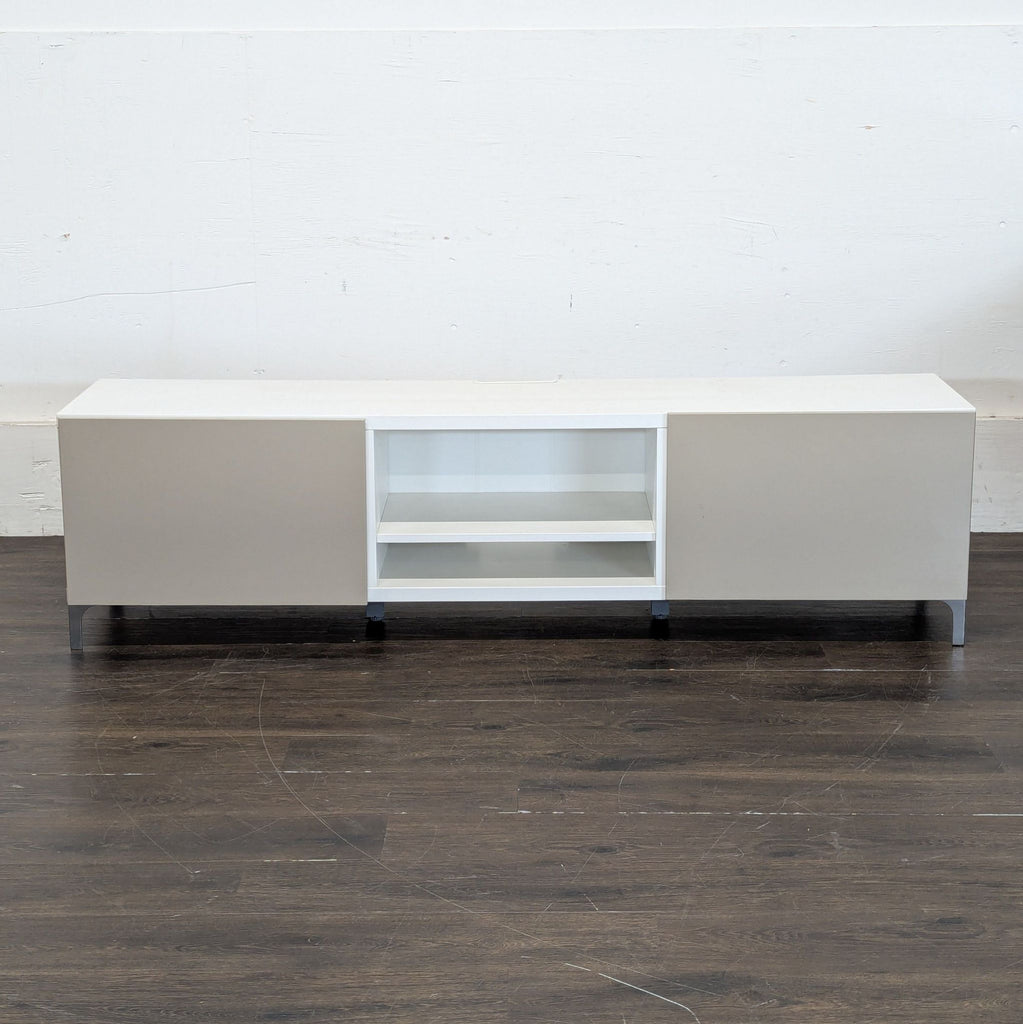 2. Sleek black entertainment unit featuring open shelves, storage drawers, and television display area.  