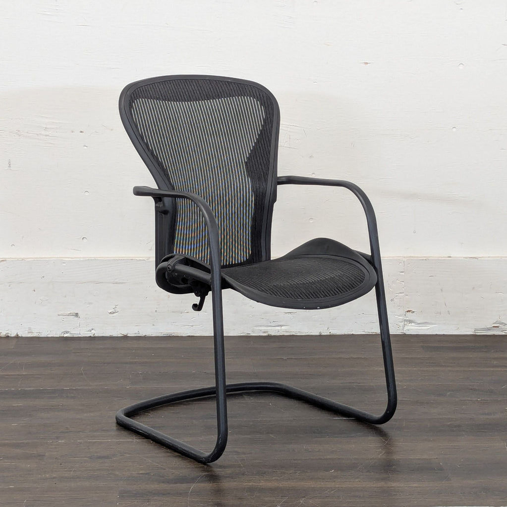 2. Sleek Herman Miller desk chair featuring adjustable armrests and a contoured seat for optimal posture.  