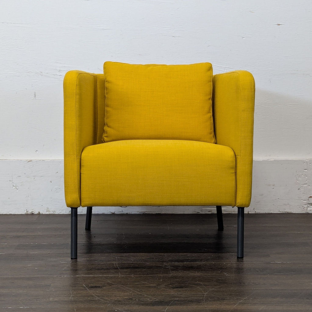 1. Modern lounge chair with plush cushions on a wooden frame, perfect for relaxing in living spaces.