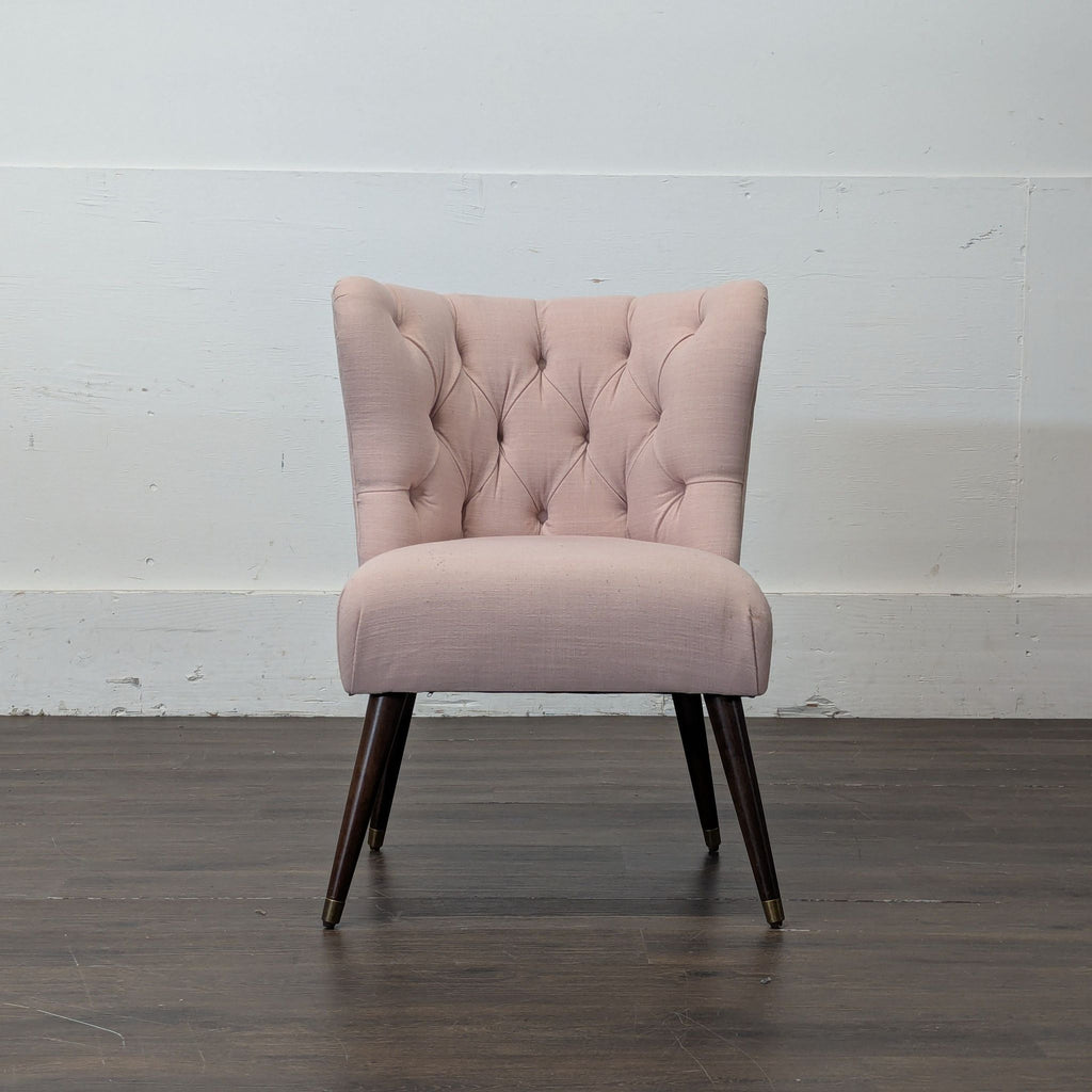 1. Modern lounge chair with plush cushions on a wooden frame, perfect for relaxing in living spaces.