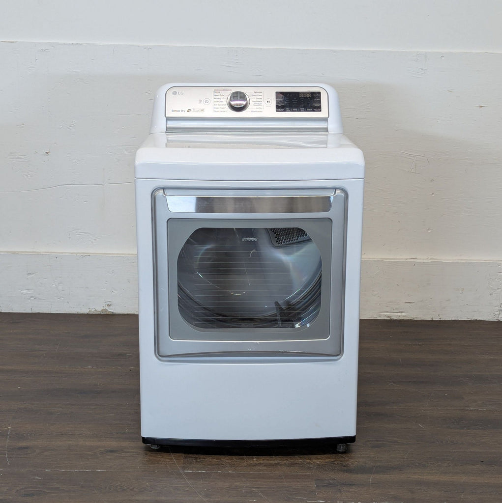2. LG washer/dryer unit featuring a spacious door, modern display, and energy-efficient design.