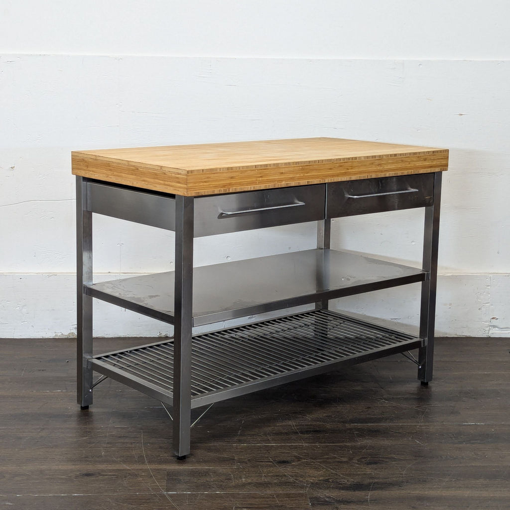 2. Compact Ikea kitchen island, featuring drawers and a durable work surface for food prep and organization.  