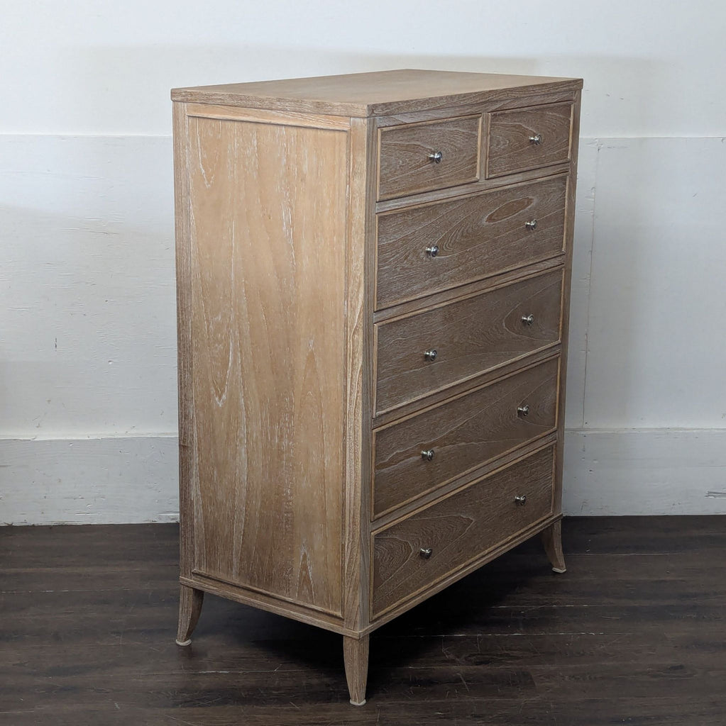 3. Side angle of Arhaus six-drawer dresser in light wood, featuring tapered legs and a modern design.