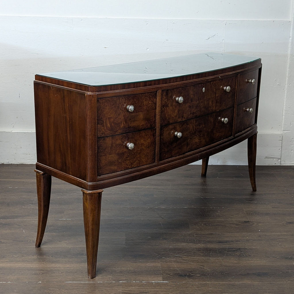 Solid wood dresser with a robust frame and elegant finish, suitable for organizing clothes or decor.