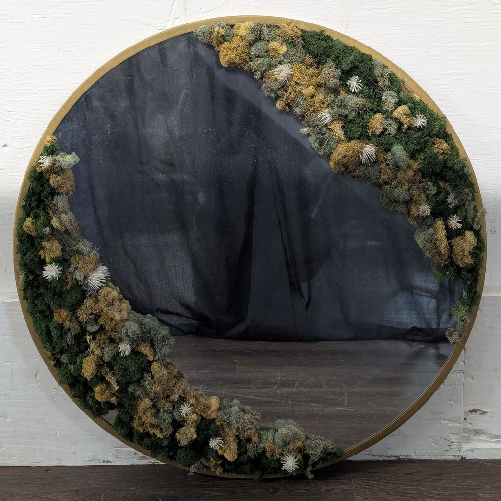 Circular wall mirror bordered by a thick, vibrant moss frame, perfect for adding a nature-inspired accent.