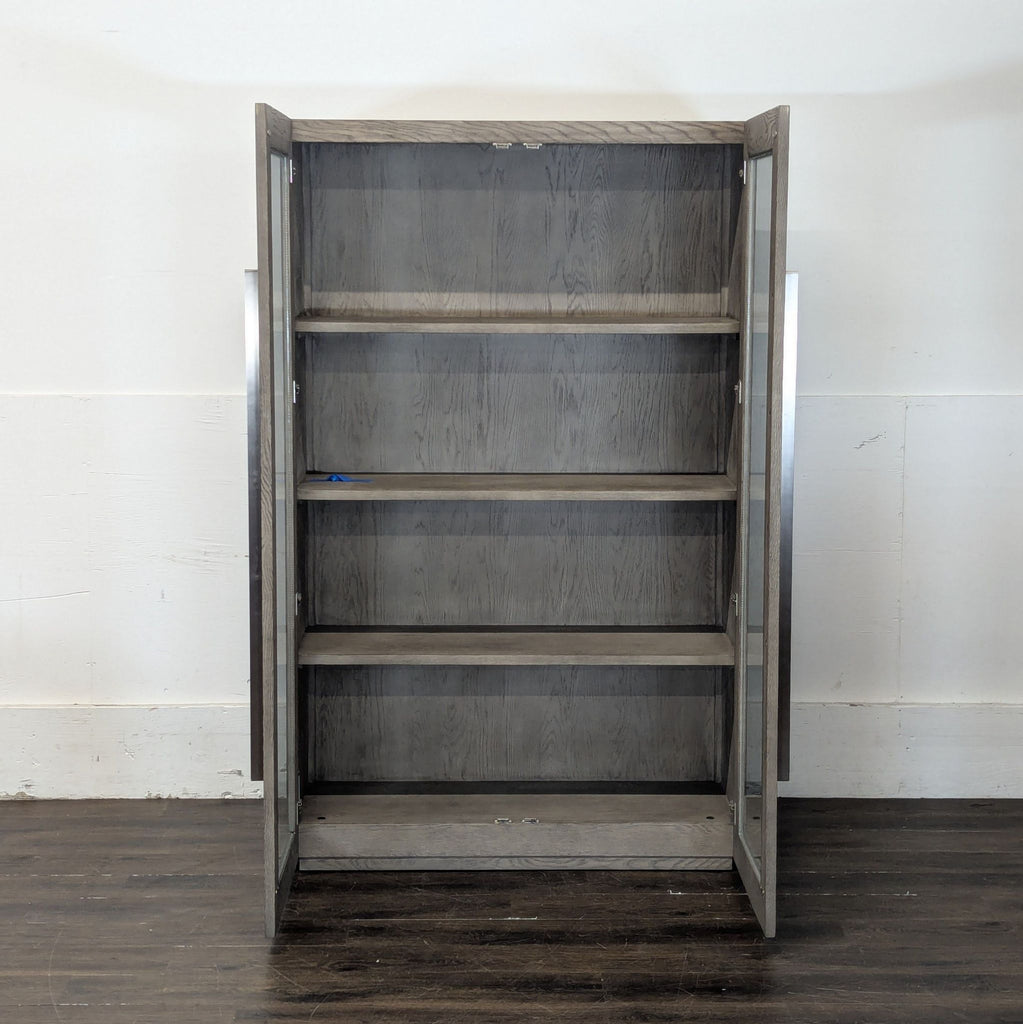 2. Stylish wooden cabinet from Restoration Hardware featuring spacious shelves and a minimalist design.