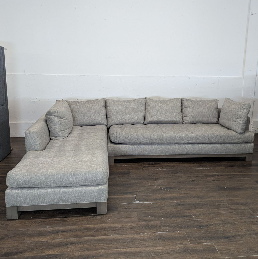 2. Contemporary Swaim brand sectional featuring sleek upholstery and modular seating arrangement.