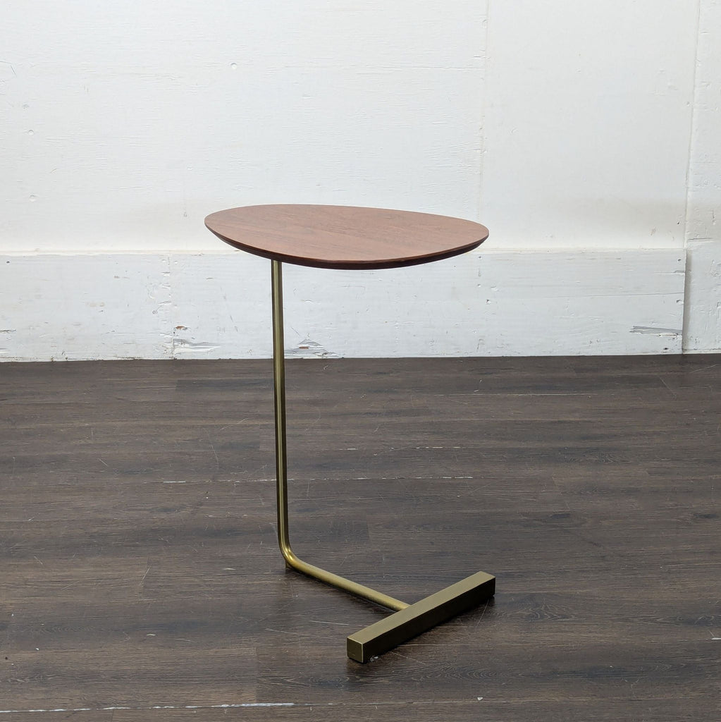 1. Sleek glass console table with black metal frame, from West Elm, perfect for modern living spaces.