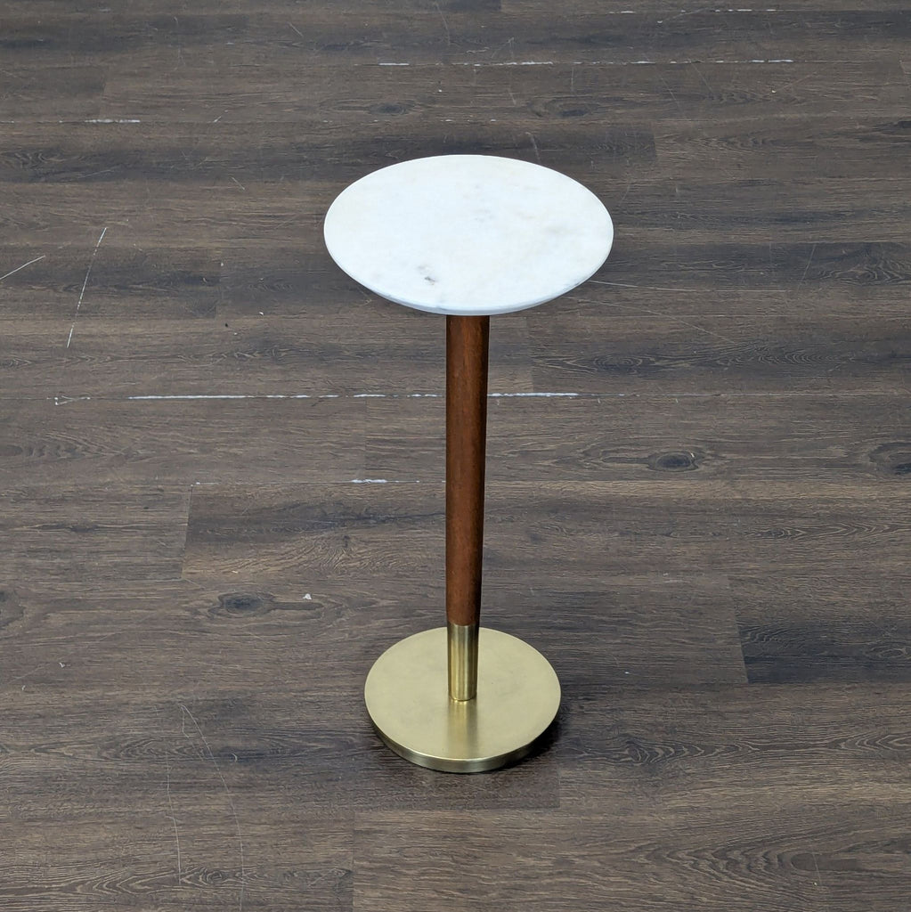 1. Sleek glass console table with black metal frame, from West Elm, perfect for modern living spaces.