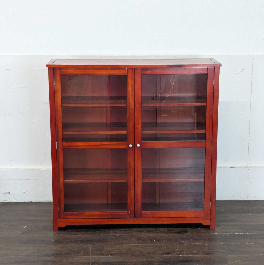 2. Wooden China cabinet featuring transparent panels and ample storage, ideal for kitchen or dining room.  