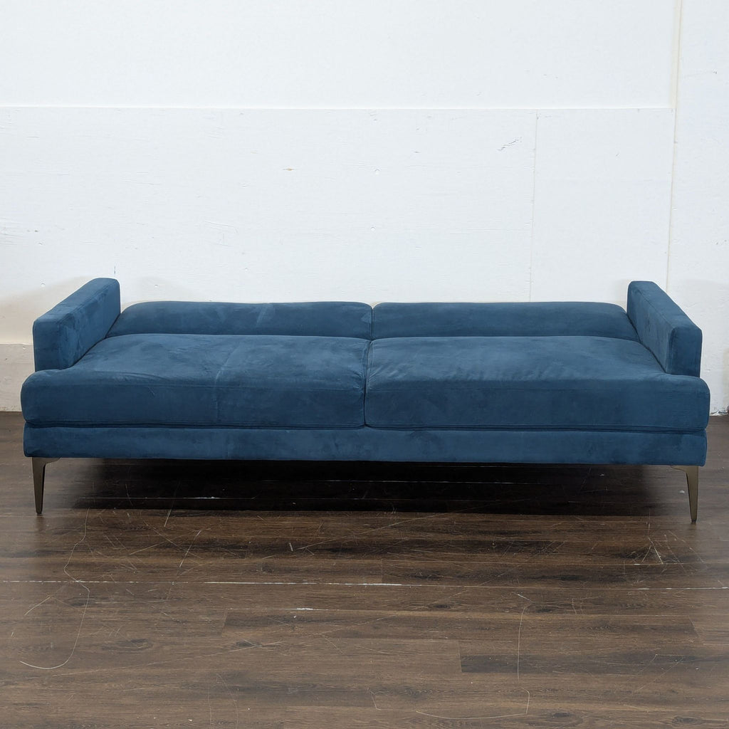 2. Comfortable reclinable sofa by Pottery Barn, seating three, ideal for living rooms.