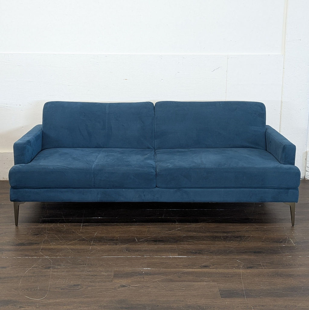 1. Three-seat Pottery Barn reclinable couch with plush cushions and modern design.