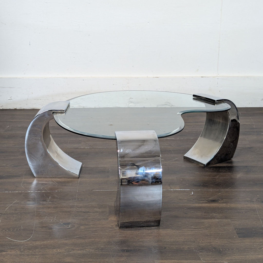 2. Minimalist coffee table featuring clean lines and a two-tone wood and metal finish.