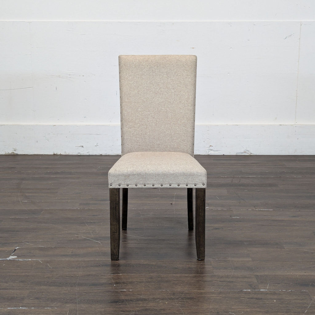 2. Group of four matching dining chairs from Pottery Barn, perfect for comfortable dining seating.  