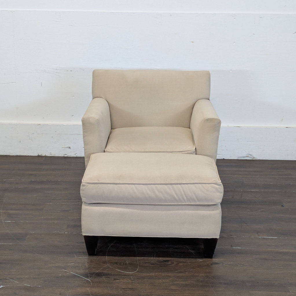 1. Modern Crate & Barrel lounge chair with plush cushions and sleek, minimalist design.