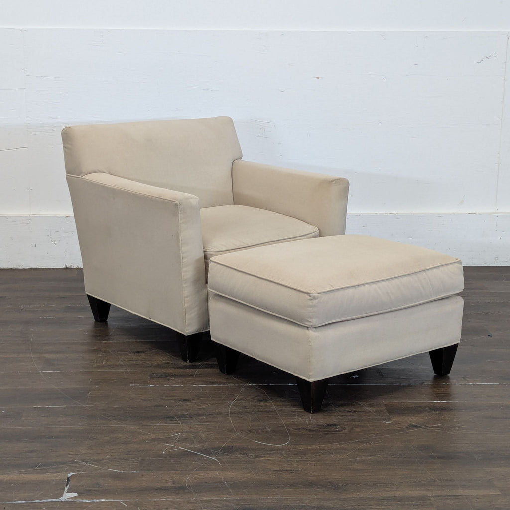 2. Contemporary lounge seat from Crate & Barrel, featuring soft upholstery and sturdy frame.