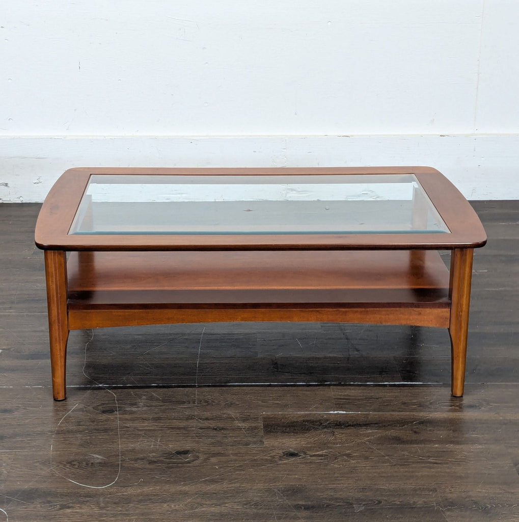 1. Modern glass top coffee table with a sleek, minimalist design and sturdy metal legs.