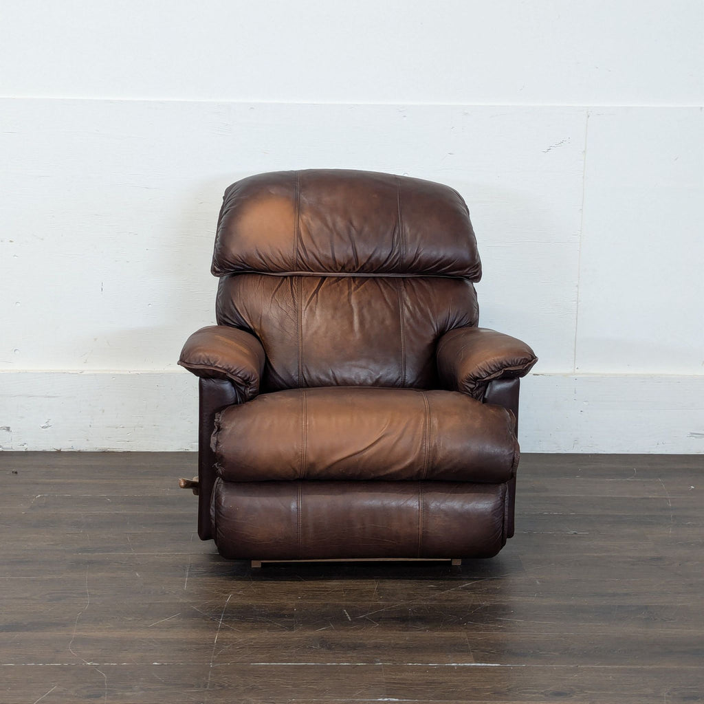 2. Sleek lounge recliner with plush leather upholstery, offering relaxing massage features.