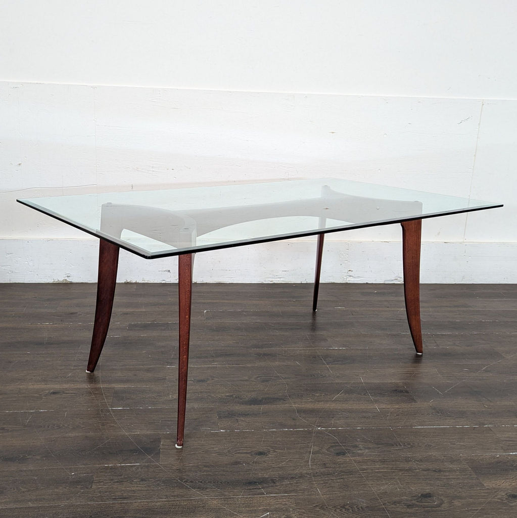 Glass dining table from Z Gallerie, paired with six chairs—four armless and two armchairs.