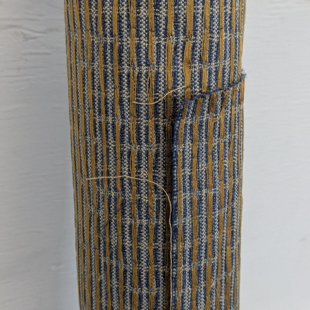 2. Close-up of textured woven fabric in blue and tan stripes from a Gildar Designs miscellaneous item.