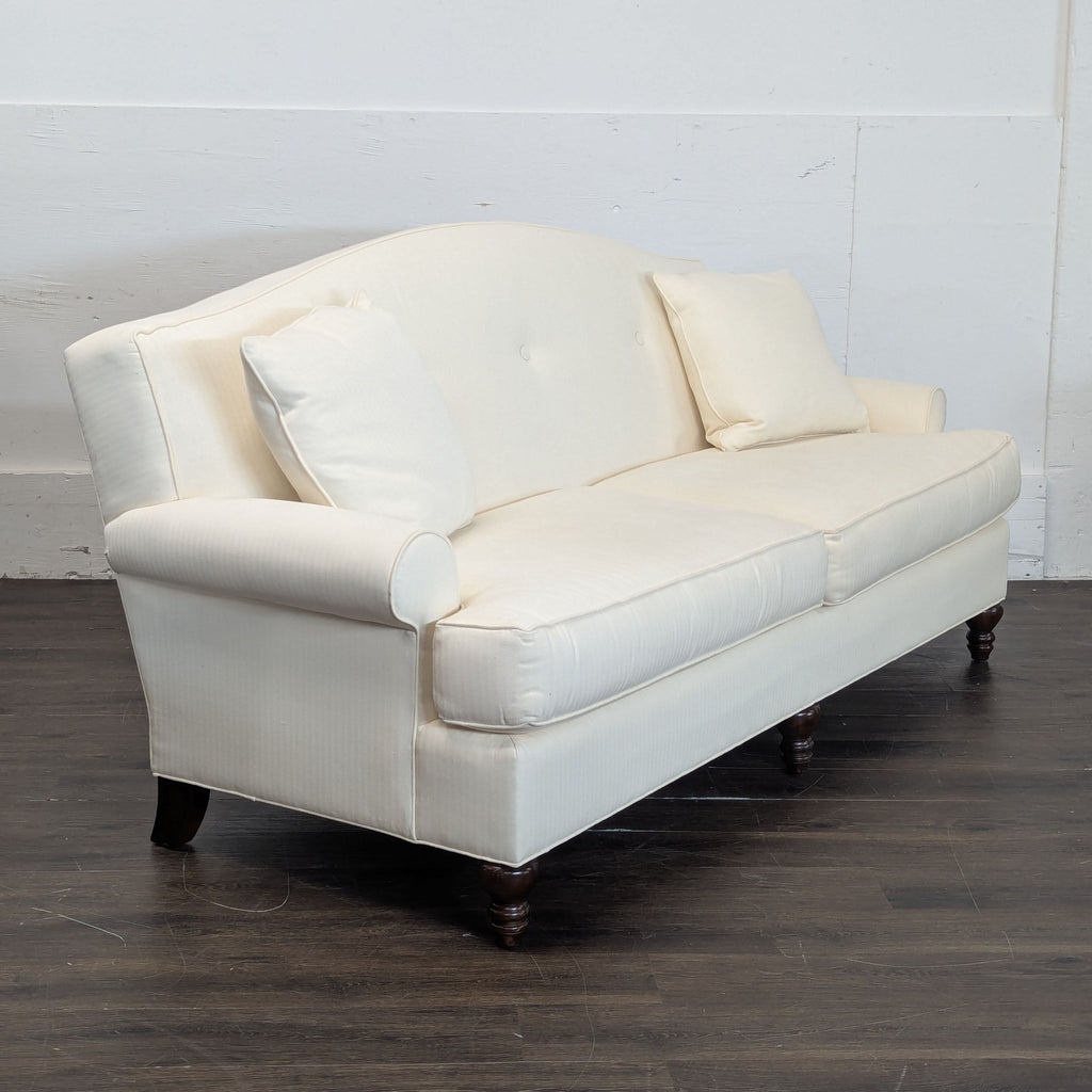 Two matching Thomasville 3-seater couches, both being sold together, pictured indoors.