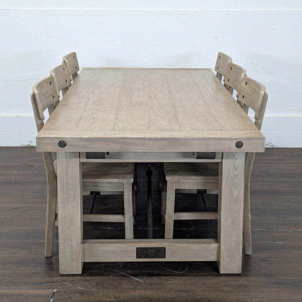 Large Pottery Barn Seadrift dining table paired with six matching chairs, showcasing 2019 price tags.
