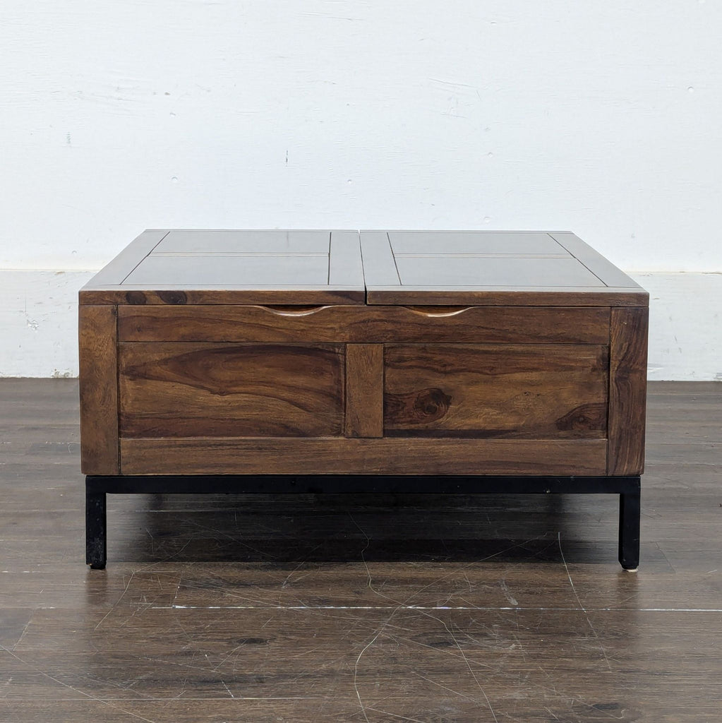 1. Rectangular Crate & Barrel coffee table with a dark wood finish and metal legs, placed on a wooden floor.
