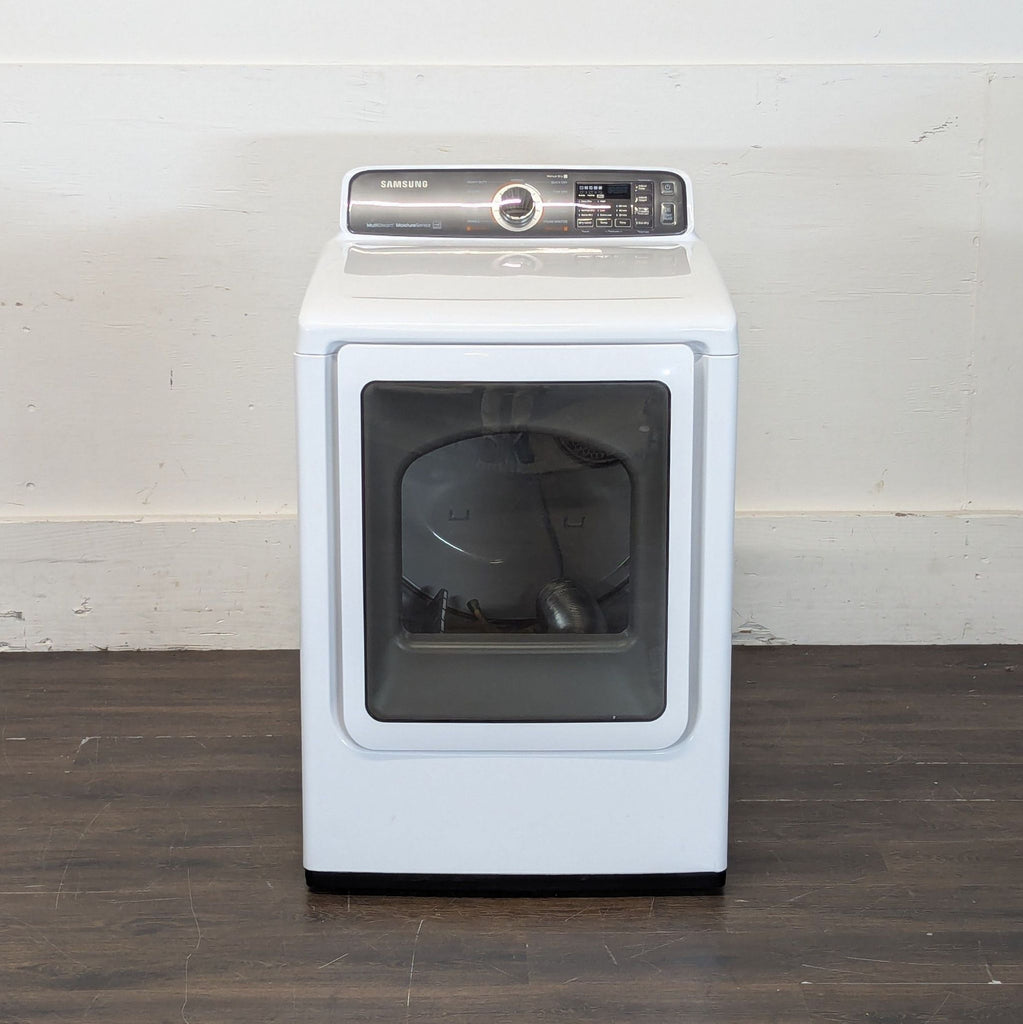 1. Front view of a Samsung washer/dryer unit with a glass door and digital control panel.  