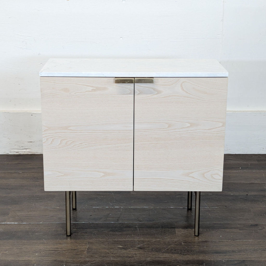 2. Sleek 2022 West Elm storage cabinet with minimalist handles and spacious shelves.  