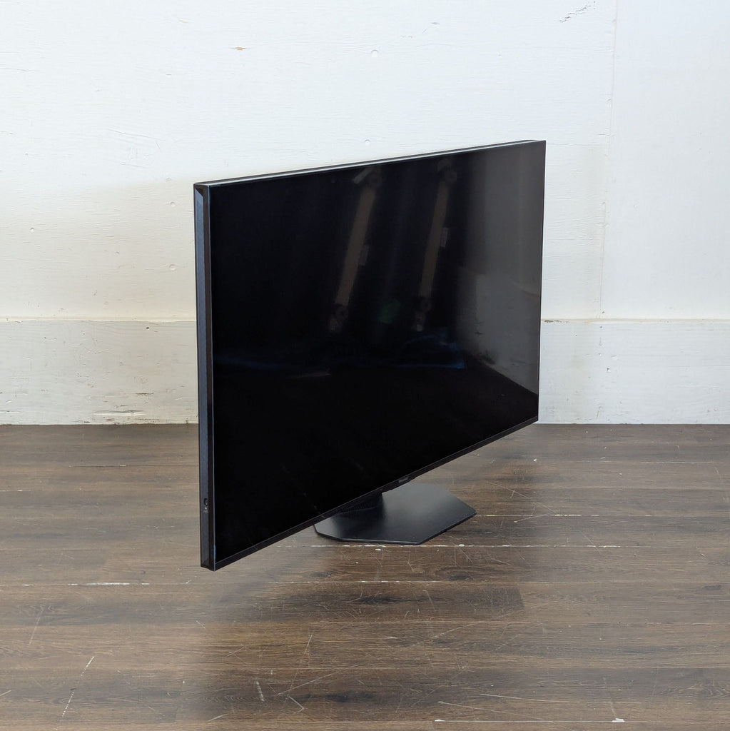 2. 4K smart television showing vivid colors and streaming apps on its main home screen.