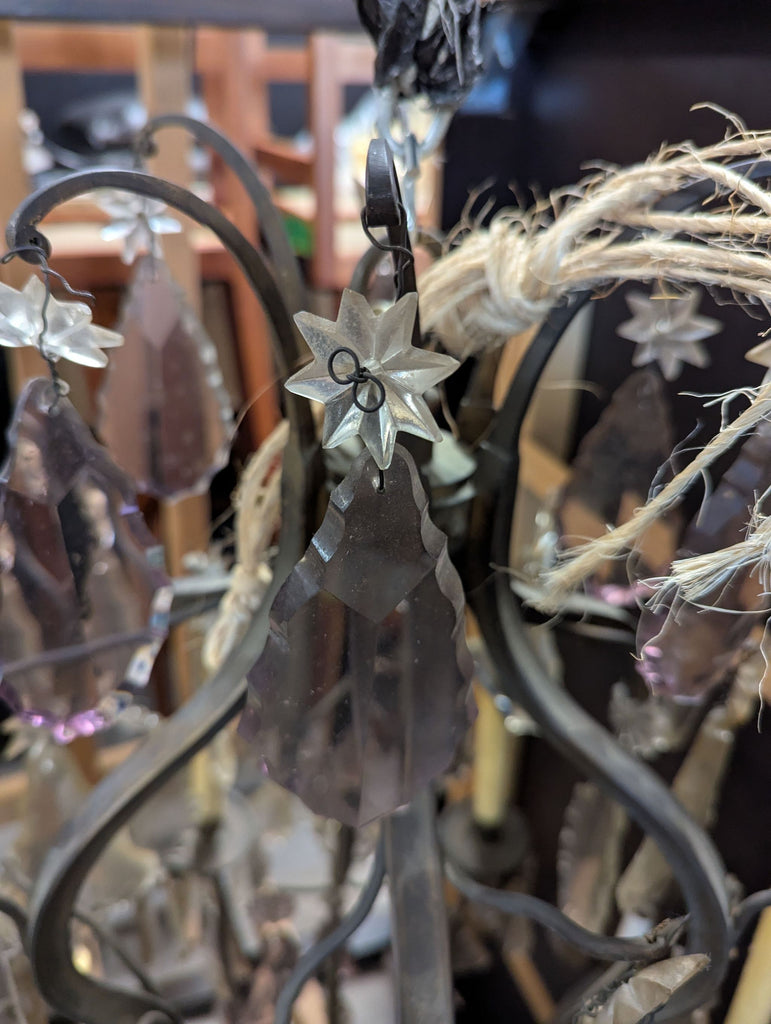 Six-light French chandelier in baroque style, featuring crystal drops and elaborate metalwork with shades.