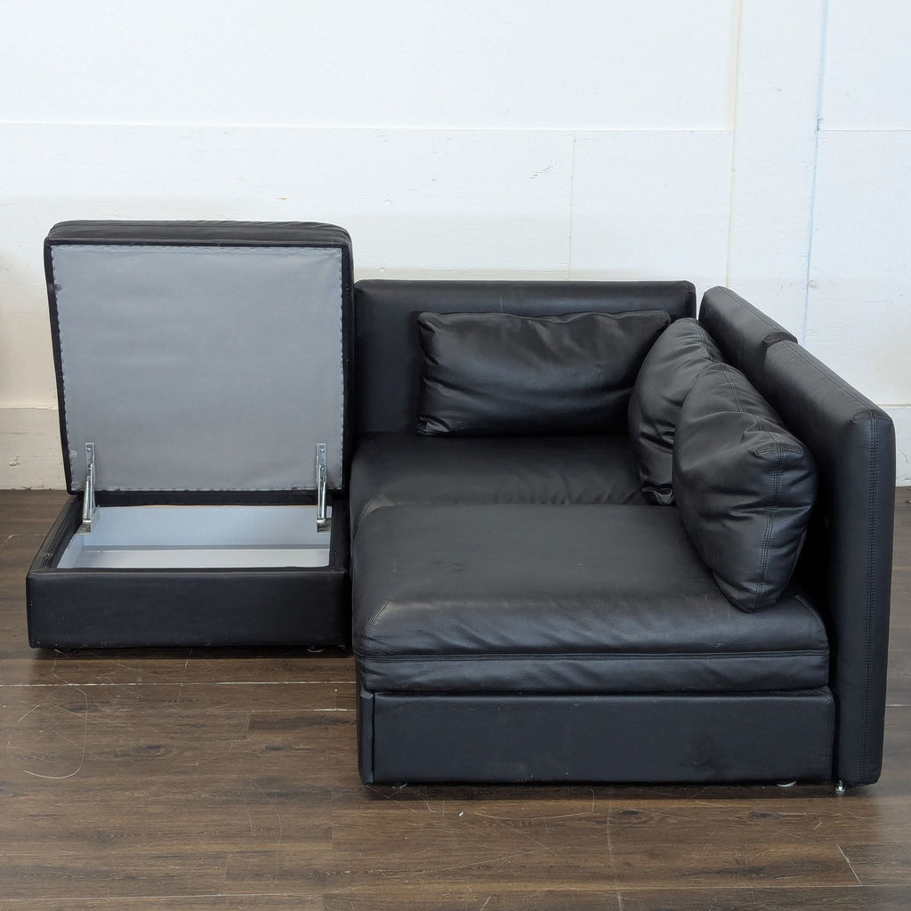 Excellent condition! 


Versatile modular sectional sofa is upholstered in black faux leather. This set includes a storage ottoman and a pull-out sleeper module. The modular design allows for various configurations to fit different living spaces. 

D