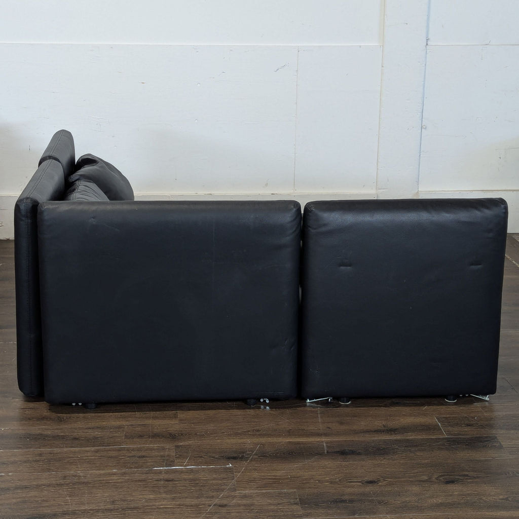 Excellent condition! 


Versatile modular sectional sofa is upholstered in black faux leather. This set includes a storage ottoman and a pull-out sleeper module. The modular design allows for various configurations to fit different living spaces. 

D