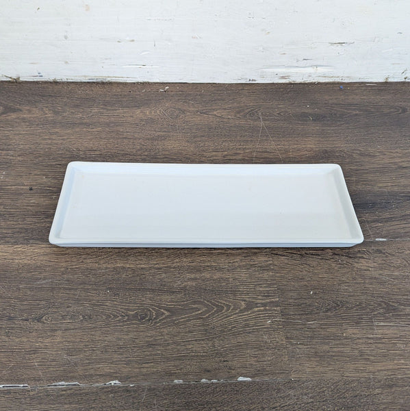 1. Rectangular white Pottery Barn serving platter displayed on a wooden surface, ideal for dishware collections.  