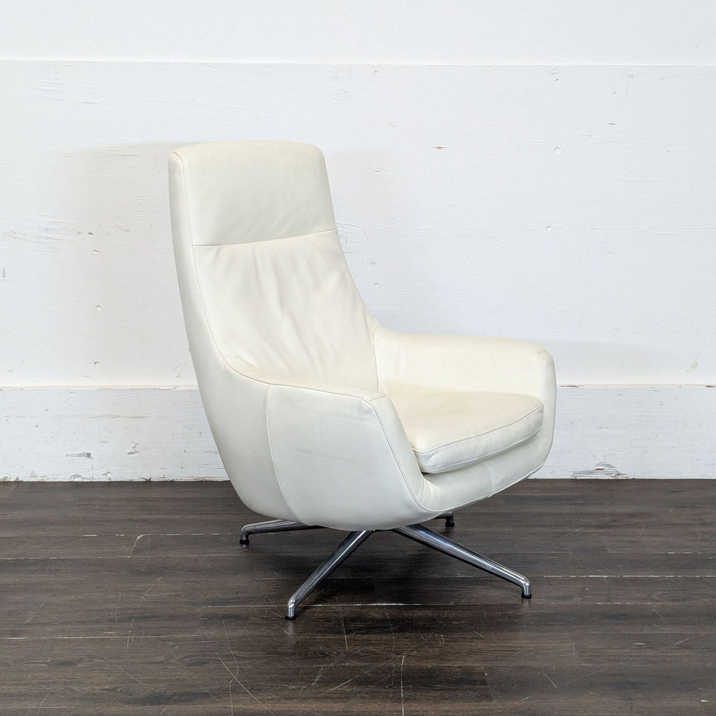 2019 Ikea lounge chair in white leather-look material, high-back style, shown with a sturdy swivel base.