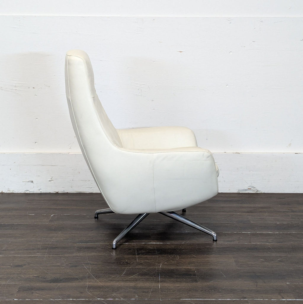 Ikea High-back white leather-look swivel lounge chair. 2019. I don't have the exact original price, but based on googling around it seems like it was roughly $400.