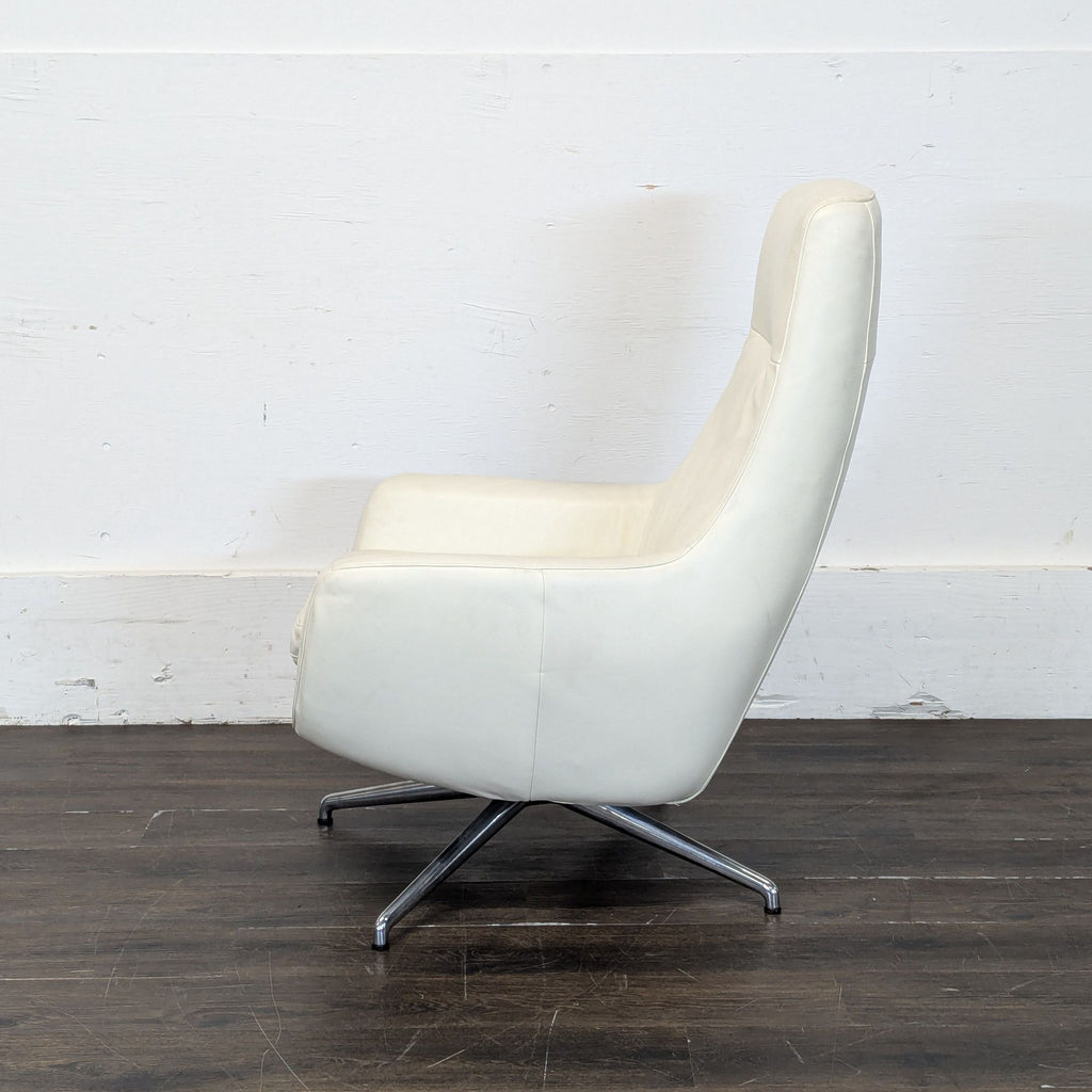 Ikea High-back white leather-look swivel lounge chair. 2019. I don't have the exact original price, but based on googling around it seems like it was roughly $400.