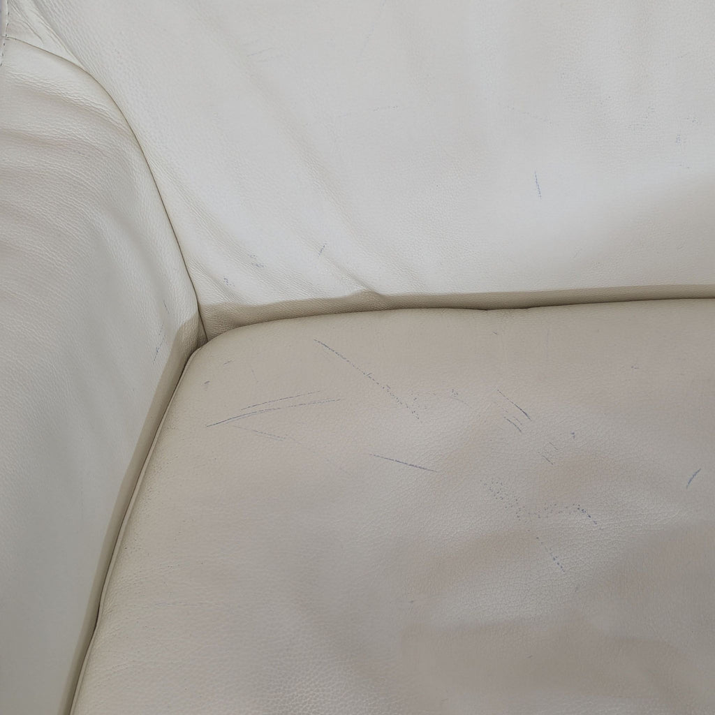 Ikea High-back white leather-look swivel lounge chair. 2019. I don't have the exact original price, but based on googling around it seems like it was roughly $400.