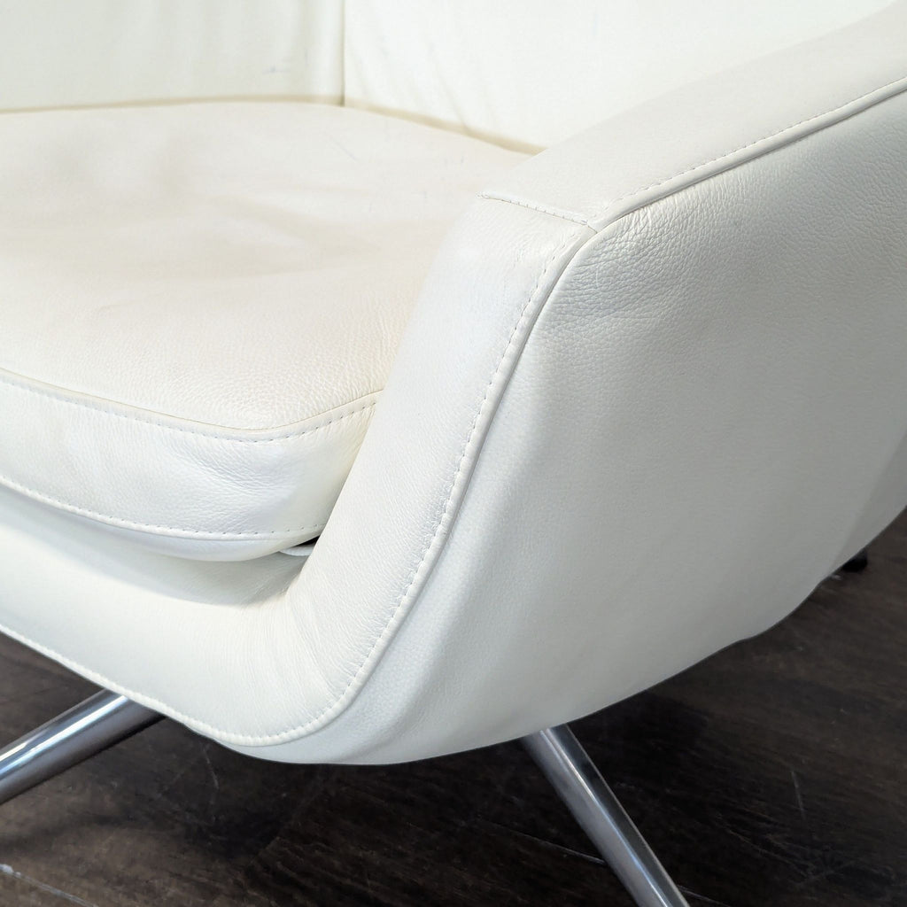 Ikea High-back white leather-look swivel lounge chair. 2019. I don't have the exact original price, but based on googling around it seems like it was roughly $400.