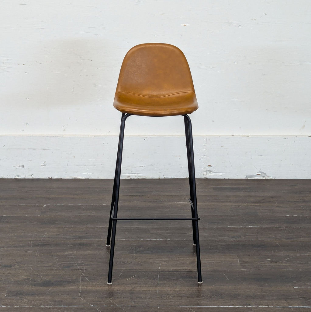 Group of four modern bar stools featuring wood seats and minimalist metal bases.