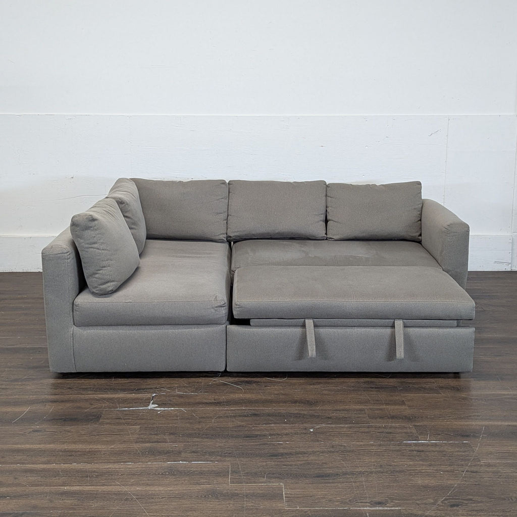Room & Board sectional with pull out ottoman and under storage