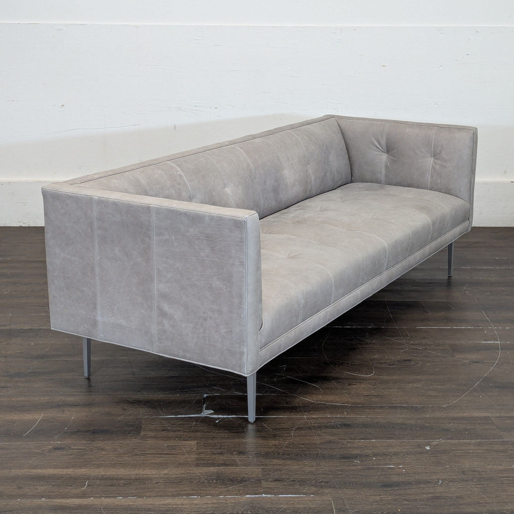 3. Sleek Annata Grey leather sofa, 3-seat design by Room & Board, measuring 90 inches long.