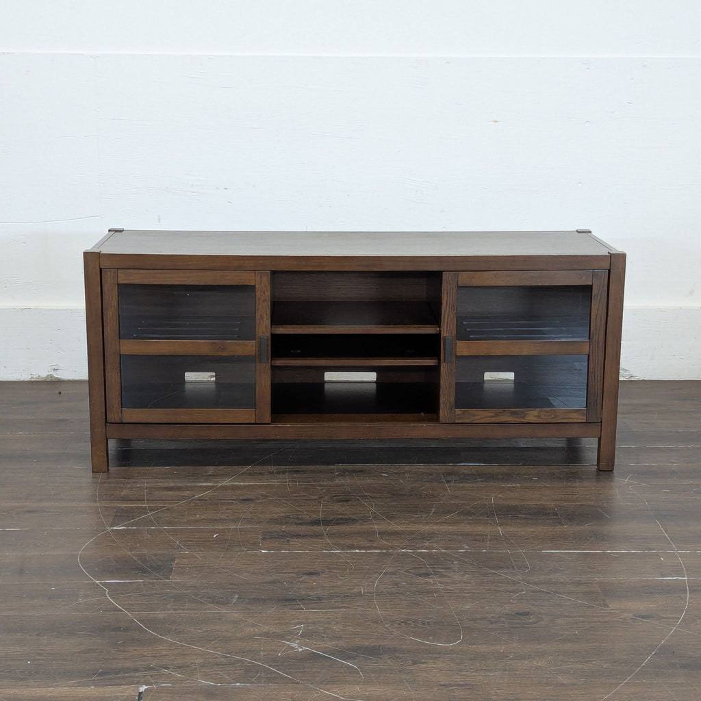 Contemporary side and console table for TVs, featuring minimalist lines and ample storage space underneath.