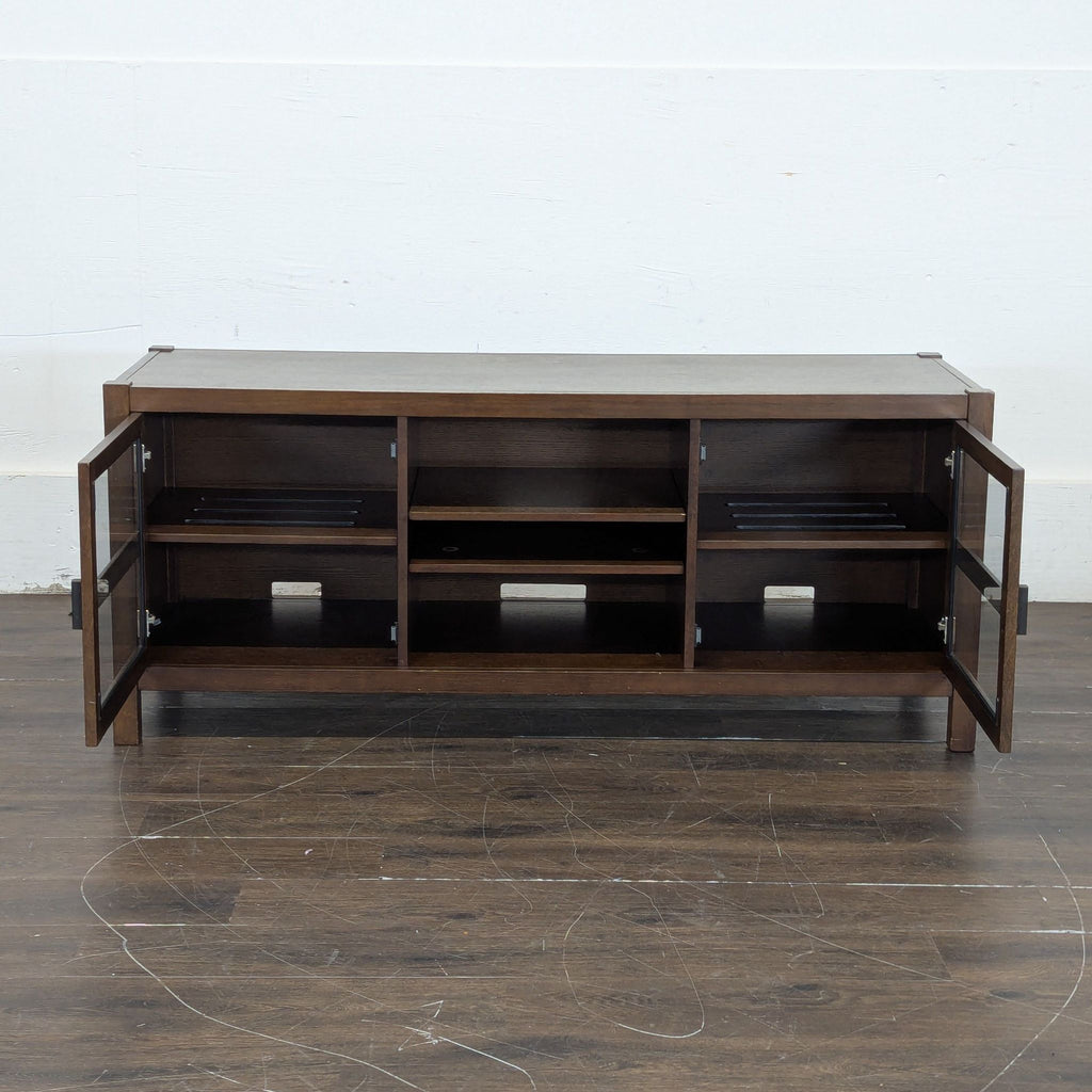 TV console table with streamlined silhouette; suitable as a side table or entertainment stand in home interiors.