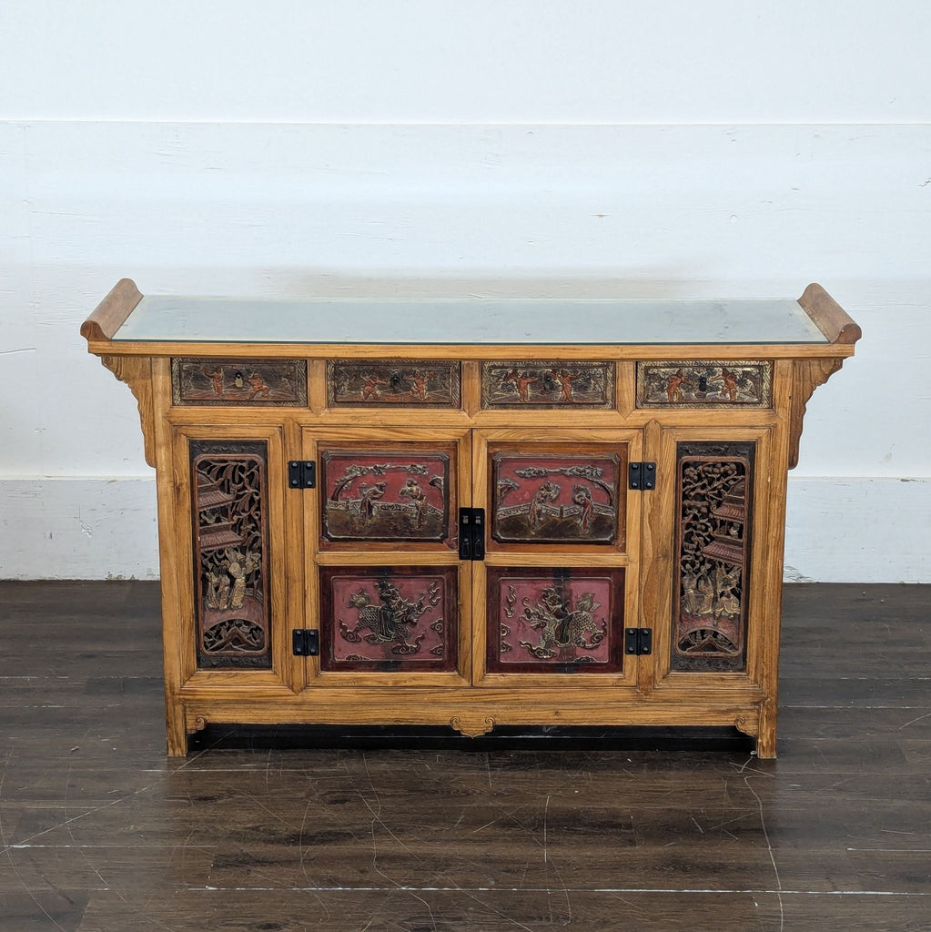 Sideboard made from ca. 1999 Chinese wedding bed panels, displaying traditional motifs and detailed wood craftsmanship.