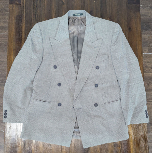 1. Men’s gray double-breasted blazer with a subtle check pattern, shown laid flat on a wooden surface.
