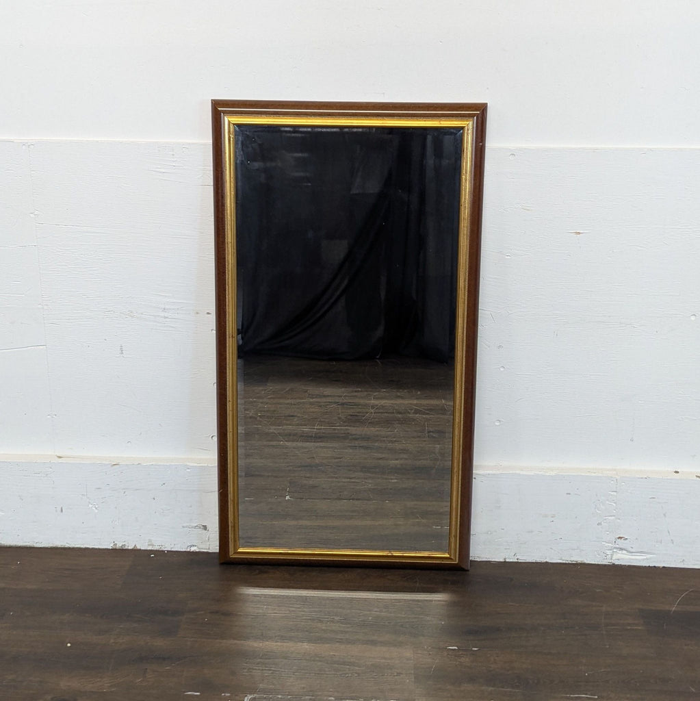 2. Circa 2007 mirror featuring a minimalist border, reflecting a plain background.  