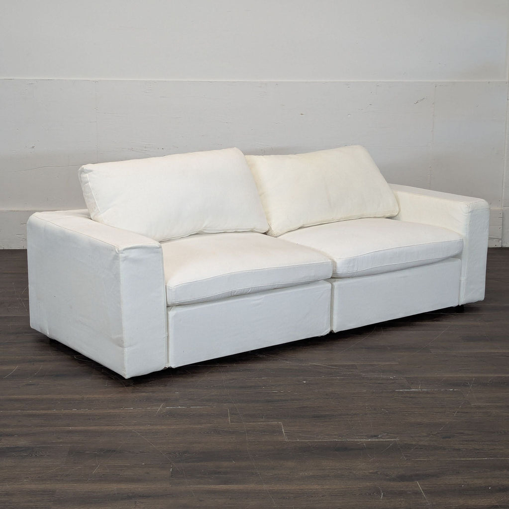 2. 7th Avenue Loveseat in neutral fabric, featuring wide armrests and ergonomic support for cozy seating.