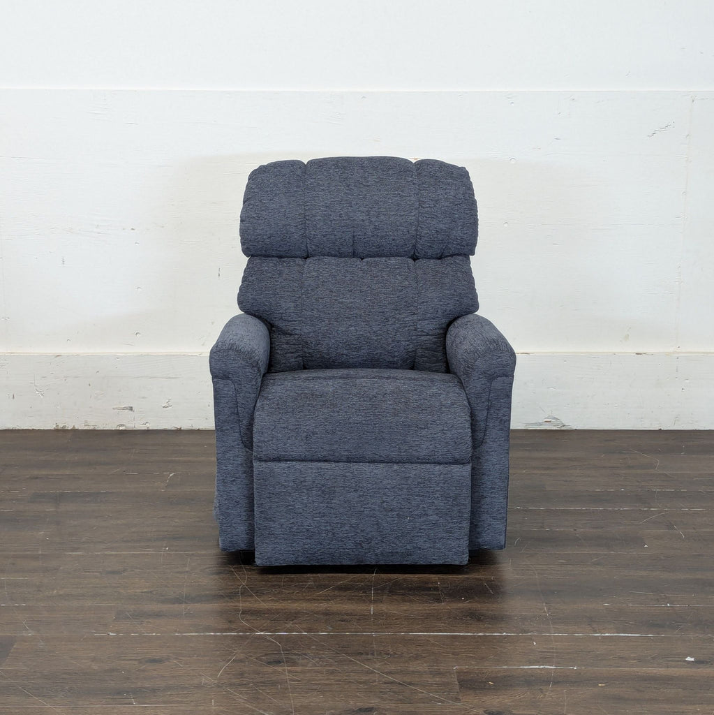 1. Modern lounge chair with a plush cushion and minimalist wooden legs in a cozy setting.
