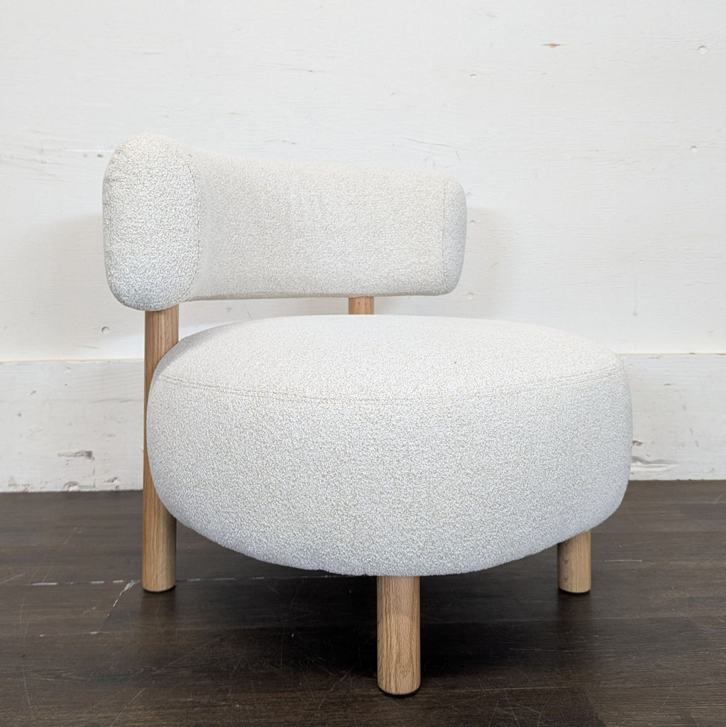 Minimalist-style IKEA Stockholm 2025 lounge armchair, gray and white fabric, photographed like new from the front.